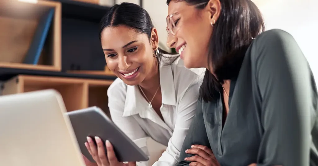 businesswomen using a digital tablet to oversee AI