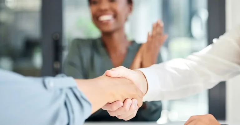 business professionals celebrating strategic partnership