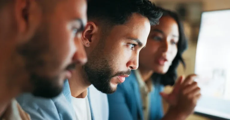 Focused professionals reviewing content on a bright computer screen, symbolizing legal teams evaluating AI platforms for enterprise use.